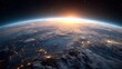 © backup_studio - Sun rising over planet Earth with city lights visible from space. Global communications and technology network concept for business.