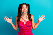 © deagreez - Young chic smiling girl in pink zebra dress with raised hands against blue background