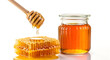 © MistoGraphy - Honeycomb and jar with dripping honey dipper on white background golden natural sweetener