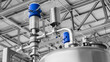 © Aleksandr Matveev - Stainless steel equipment for the production of dairy food products, metal, rubber and plastic pipes, dairy factory.