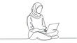 © kalsoam - A woman wearing a hijab sits cross-legged on the floor with a laptop in a minimalist setting.