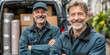 © Gonzalo - Two smiling delivery men in uniform stand in front of a van loaded with boxes, representing teamwork, logistics, and reliable courier service.