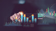 © chaylek - Financial analysts examine market performance through interactive bar charts and data graphs, representing financial analytics, trend comparison, performance tracking, and data driven decision making.