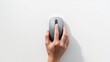 © Setya - Top view of a human hand using a modern gray wireless computer mouse isolated white background concept