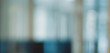 © makeeasy - Abstract blurred office background with modern corporate interior and soft bokeh light effects creating a professional blue architectural atmosphere for business website headers.