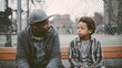 © 123sasha - Father and son sit on a bench and have a conversation in a park during a cloudy day in the city