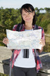 © auremar - happy woman in the mountain with a map