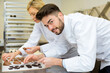 © auremar - portrait of chef holding chocolate shapes