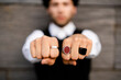 © Westend61 - Man's hands with three various rings, close-up