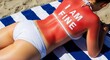 © ArtShop - Woman lounging on beach towel with sunburned back saying 'I AM FINE'