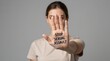 © Generative AI - Woman raising hand with Stop message against violence, sexual abuse, harassment. Protection and support