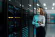 © Rendara Studio - 3D woman inspecting data server holding tablet device