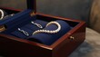© Agusstudio - Elegant pearl necklace and earrings displayed in a luxurious wooden jewelry box