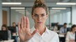 © Generative AI - Businesswoman Holding Hand Up to Stop, Stating No in Corporate Office, Diverse Team Working in Background