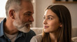 © StockHaven - Close-Up Portrait of a Father with Whitish Beard Advising His Daughter