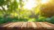 © pite - Sunlit garden background with blurred effect behind a wooden table, perfect for lifestyle blogs, marketing materials, artistic compositions, and decorative purposes. The natural light adds warmth and