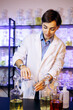 © Petro - Female perfumer crating perfumes at her laboratory