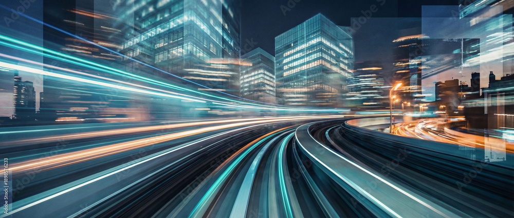Abstract motion blur of light trails through a modern city skyline ...