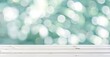 © Natalia - White wooden table top with soft bokeh background