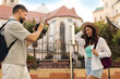 © Home-stock - Couple tourists enjoy taking pictures in historic area while exploring the city on a sunny summer day, man using photo camera