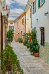  Historic town of Alcudia in Mallorca, known for its well-preserved medieval walls, charming old streets, and lively atmosphere. A popular destination offering cultural heritage, local shops, and tradi