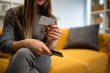© Zoran Jesic - Woman making online purchase with credit card and smartphone