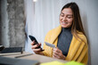 © Zoran Jesic - Woman shopping online with smartphone and credit card