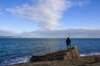 © fabrizio maffei - solitary man sitting bench misty sea fog beach winter sadness melancholy depression thinking mental health concept solitude peaceful view coast blue monday cold overcast quiet