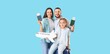© Pixel-Shot - Happy family with passports, tickets and paper airplane on blue background. Tourism concept