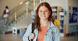 © MagicDavid25/peopleimages.com - Education, portrait and smile of teen student on high school campus for development or growth. Future, learning and study with happy girl learner in academy hallway for knowledge or opportunity