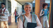 © MagicDavid25/peopleimages.com - Mature woman, portrait and teacher with confidence in school for higher education or learning. Female person, happy instructor or academic professor with smile for tutoring service or help on campus