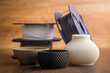 © Jiri Hera - Plastic filament for 3D printer and printed products on wooden table.