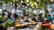 © Design&PNG - Modern indoor cafe or coworking space with people working and socializing under hanging plants and warm lighting