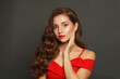 © artmim - Glorious woman with long hair and make-up on black background. Gorgeous woman with curly hairstyle