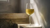 corretto. A clear glass of white wine on a stone ledge with condensation. bar promotions, beverage menus, designed for food & beverage menus and cafe branding, enhances appetite appeal.