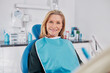 © Rido - Happy mature woman smiling  at dentist