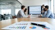 © Yuliia - Business team analyzing financial data charts and graphs during corporate meeting in modern office conference room with reports on table.