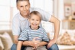 © BillionPhotos.com - Happy father or grandfather with cute child at home