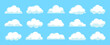 © NUSRAT - Collection of various white cartoon clouds on blue sky background