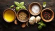 © mila103 - Rustic culinary ingredients: oil, coriander, salt, pepper, garlic, basil on dark wooden table.