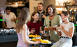 © JackF - Happy mens and womens drinking beer and eating crisps, laughing and spending time together in a bar