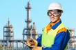 © BillionPhotos.com - Professional engineer man standing at oil refinery.