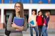 © BillionPhotos.com - Students life concept. Happy girl with books