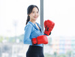 © Bangkok Click Studio - Asian young beautiful happy woman fit sporty healthy in sportswear boxing gloves learning practicing workout energy  exercise or learning self defense training in bright fitness gym wellness lifestyle