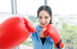 © Bangkok Click Studio - Asian young beautiful happy woman fit sporty healthy in sportswear boxing gloves learning practicing workout energy  exercise or learning self defense training in bright fitness gym wellness lifestyle