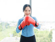 © Bangkok Click Studio - Asian young beautiful happy woman fit sporty healthy in sportswear boxing gloves learning practicing workout energy  exercise or learning self defense training in bright fitness gym wellness lifestyle