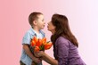 © BillionPhotos.com - Mother's Day! Charming child and beautiful mother with flowers