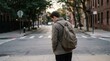 © Pornfa - Young man walking alone in city street at dusk, urban neighborhood with muted tones and quiet atmosphere