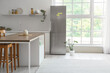 © Pixel-Shot - Interior of kitchen with modern fridge, table and shelf