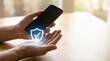 © Chanoknan - Mobile device data protection illustration with shield icon overlay in hand gestures, advanced digital security authentication interface for secure communication and privacy optimization